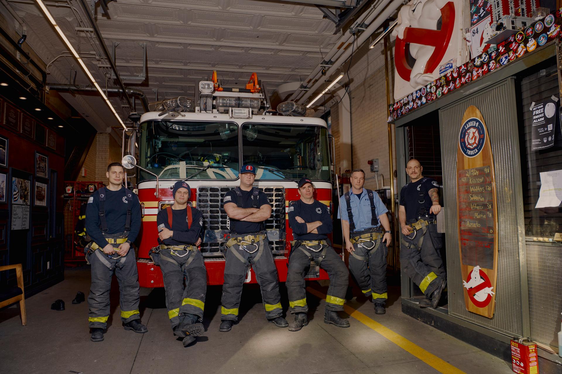 Firefighters in front of truck