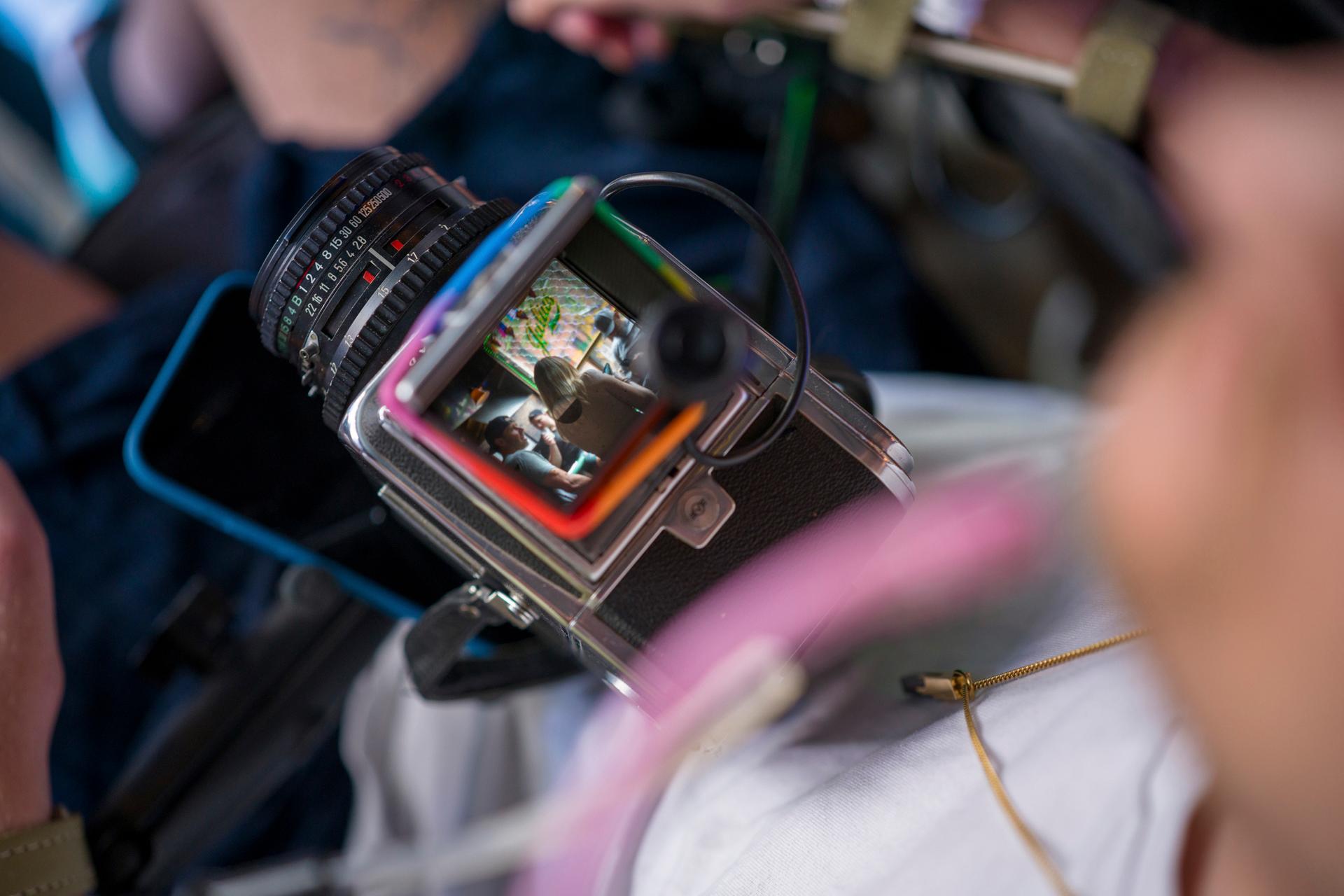 Photographer Robert Andy Coombs taking a picture on a medium format camera